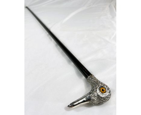 An early 20th Century lady's ebonised walking stick with silver bird's head finial, 92cm.
