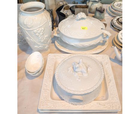 A large white pottery lidded tureen and ladle on stand, other white serving dishes etc.
