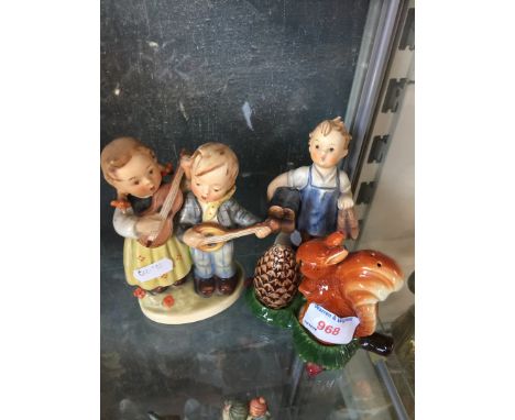 2 Hummel figurines and a Hummel salt and pepper squirrel 