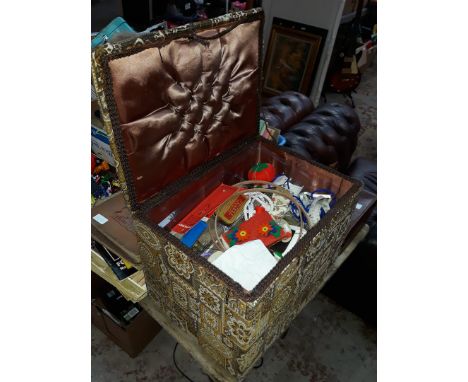 Pouffe of sewing accoutrements 