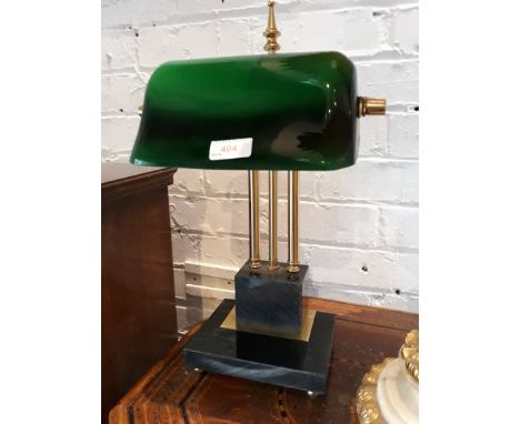 A desk lamp with green glass shade and granite base 