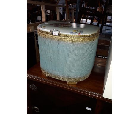 A blue woven lloyd loom style basket 