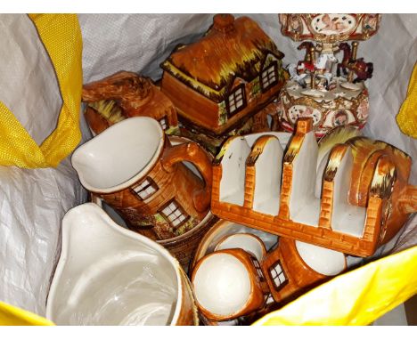 A bag of misc ceramic ornamental items including carousel, etc 