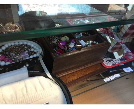 Shelf of jewellery boxes and costume jewellery 