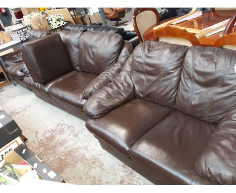 A 3 piece brown leather suite and pouffe 