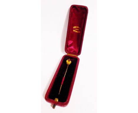 A citrine set tie pin, mounted in yellow metal, in leather fitted box
