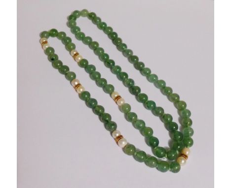 A strand of jade and pearl set beads with six yellow metal spacers