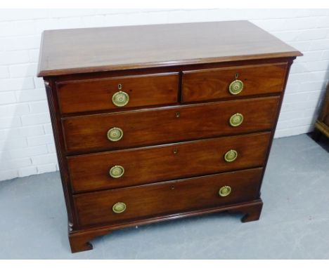 A 19th century  mahogany chest, the rectangular top with moulded edge, over two short drawers and three long drawers, raised 