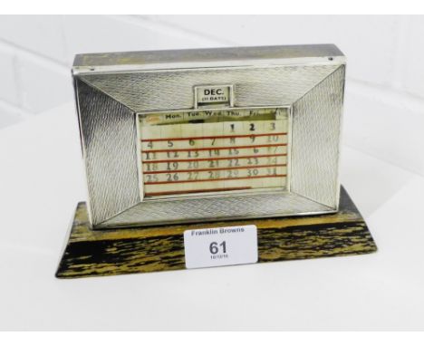 A George V silver engine turned and oak desk calendar, 17 x 11cm