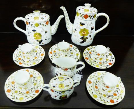 A Royal Crown Derby bone china tea and coffee set in pattern 8687, comprising teapot, coffee pot, twin handled sugar bowl, mi