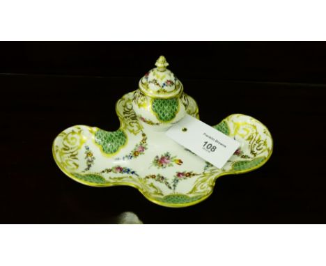 A Dresden porcelain inkwell with green scale reserves and rococo style gilding and hand painted floral sprays, marked Asprey 