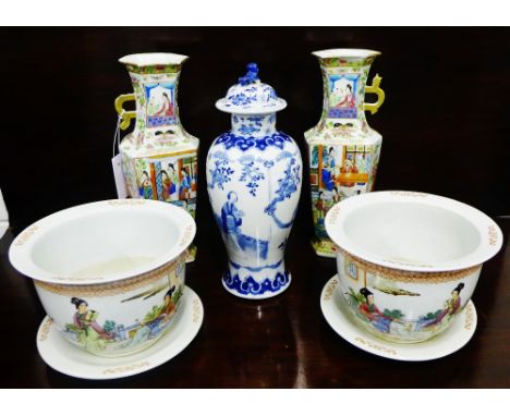 A pair of 20th century Chinese planters with saucer plates, painted with female figures in a garden landscape and calligraphy