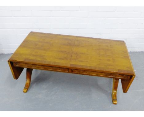 A yewwood coffee table with drop flaps, 44 x 108cm