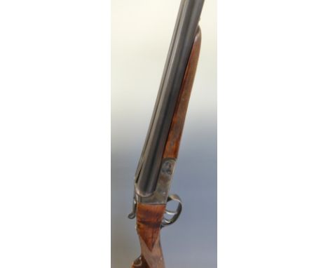 AYA 12 bore side by side shotgun with chequered grip and forend, raised ball sight, double trigger and named 28 inch barrels,