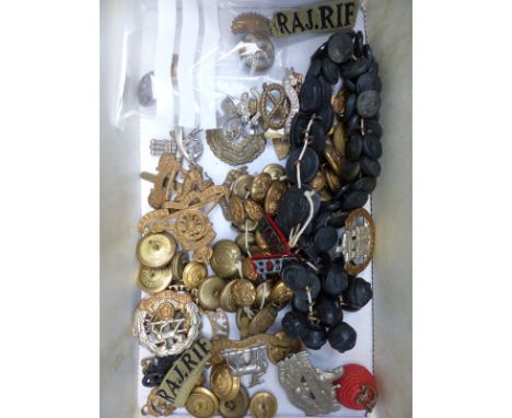 A collection of military badges and buttons including Royal Munster, East Sussex, Dorset, Canadian Ordnance, large quantity o