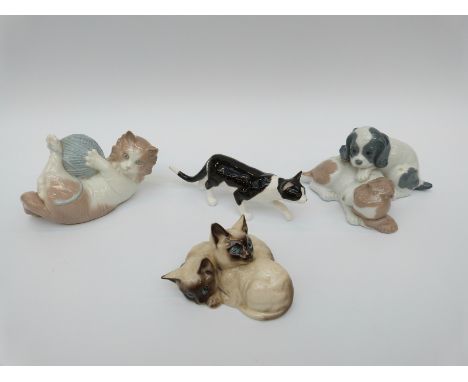 Royal Doulton model of two kittens, a Beswick cat, a Nao kitten with a ball of string and a Nao model of two puppies