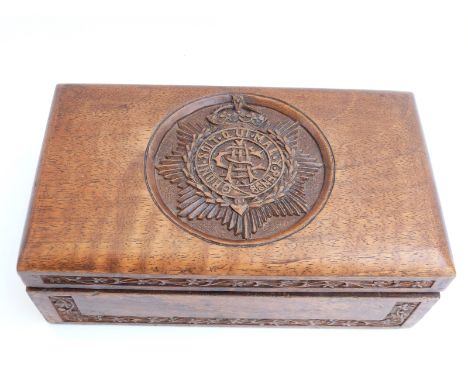 A WWI Army Service Corps carved Indian wooden box, the hinged lid engraved with the ASC badge and FC to the underside