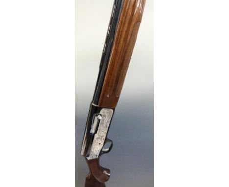 Luigi Franchi Hunter 12 bore semi-automatic shotgun with engraved scenes of hunters in a boat and birds to the lock, chequere