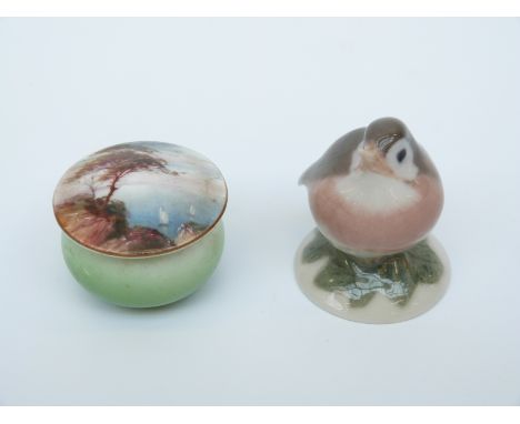 A Royal Worcester lidded pill pot decorated with a painted coastal scene and a Copenhagen bird