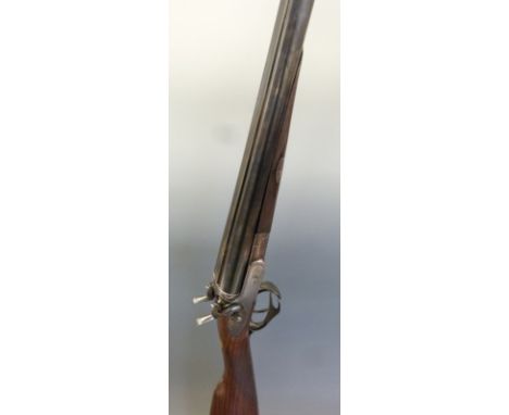 James Purdey 16 bore side by side hammer action shotgun with fine scrolling engraving to the locks, stylised dolphin hammers,