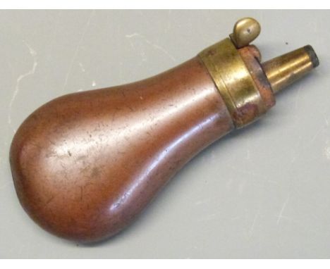 A very small copper and brass pistol powder flask, 6.8cm long. 