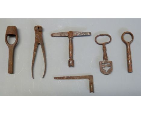 Six various cartridge or percussion gun tools including a T-shaped nipple wrench/ key and nipple pricker, wad punch, cartridg