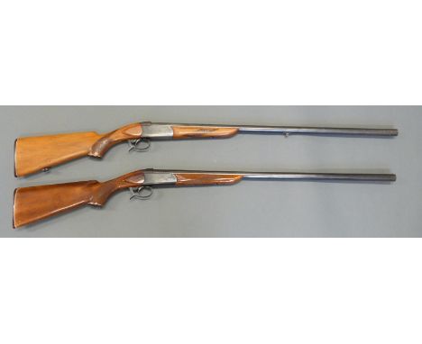 Two Russian Baikal single barrelled 12 bore shotguns both with engraved locks, chequered semi-pistol grips and forends and ba
