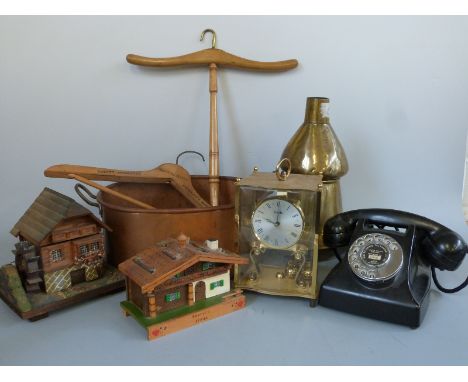 A black bakelite Reliance GEC telephone 9T/ATS, together with a brass Kundo anniversary clock, two Black Forest musical jewel