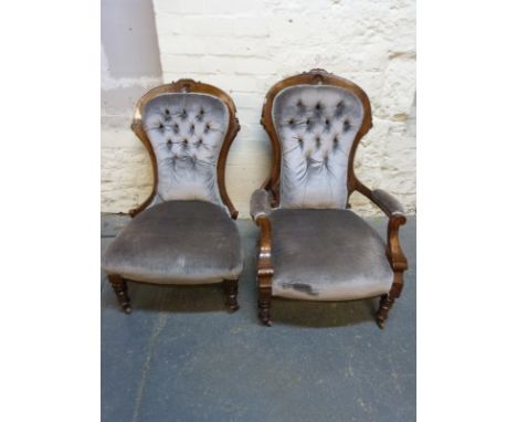 A Victorian King and Queen pair of upholstered button back mahogany chairs 
