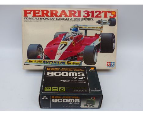 Tamiya 1:10 scale model kit Ferrari 312T3 A1001 with Acoms remote control, both in original boxes.  