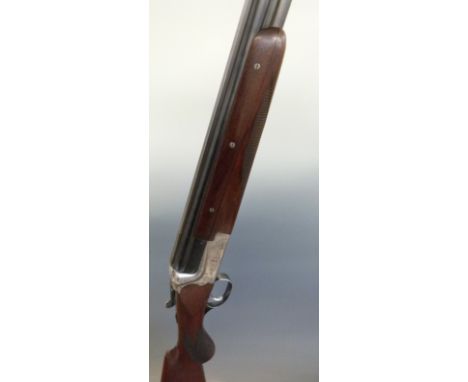 Merkel 12 bore over and under ejector shotgun with engraved lock, top plate, top lever, underside and trigger guard, chequere