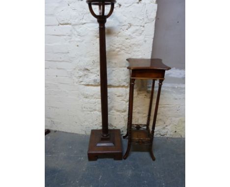A reeded mahogany torchere and a four pillar plant stand