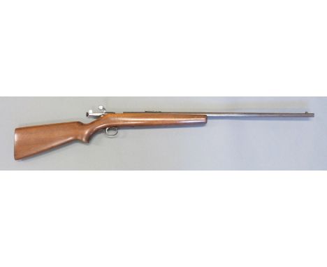 Winchester Model 67 .22 smooth bore bolt action gun with semi-pistol grip, peep sights and 27 inch barrel, overall length 118