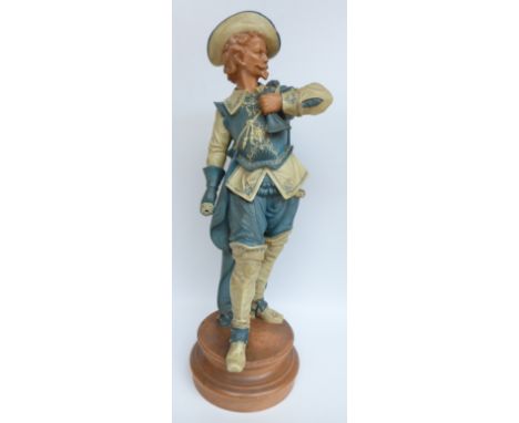 A large 19th/20thC pottery figure of a Cavalier on a terracotta base in Goldscheider style, impressed Gand SL to base and dat
