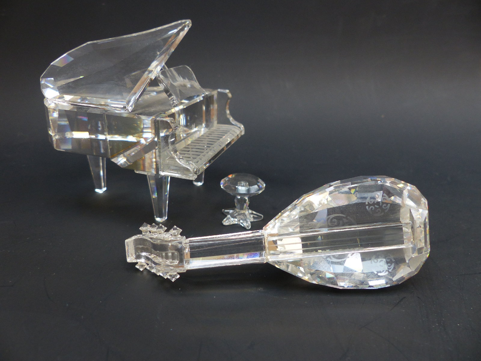 Two Swarovski Crystal musical instruments comprising a grand piano, 6cm