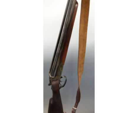 Merkel 12 bore side by side shotgun with engraved locks, chequered grip and forend, raised matte rib, ball foresight, double 