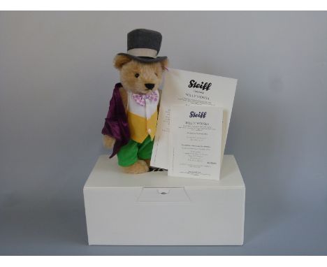 Steiff Teddy Bear Willy Wonka with blond mohair, purple coat, green trousers, yellow and white waistcoat, grey top hat, Roald