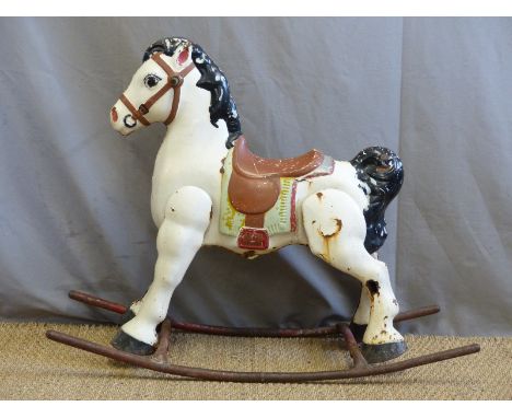 A vintage metal painted rocking horse. 
