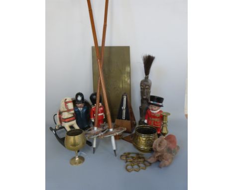 A carved African tribal figure, metronome, copper bed pan, vintage ski poles etc