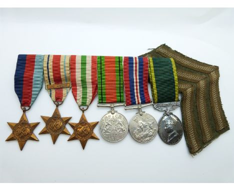 A group of six WWII medals comprising 1939/1945 Star, The Africa Star with 1st Army clasp, The Italy Star, War medal, Defence