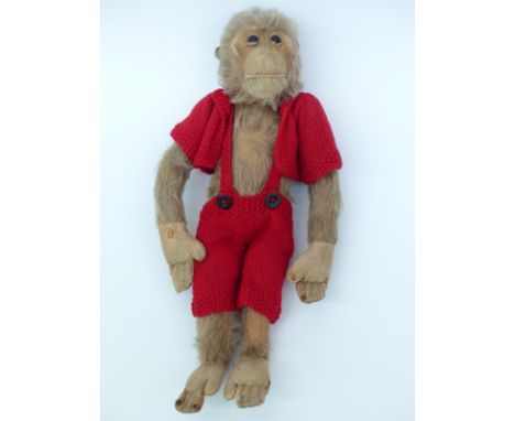 A vintage monkey Teddy bear with blonde mohair, felt hands, feet and face and straw filling, 37cm tall