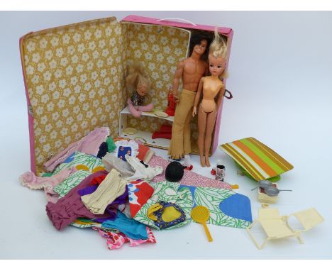 Two Sindy and Barbie dolls together with a large quantity of clothes and accessories in a Mattel The World of Barbie Doll cas