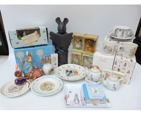 A quantity of Beatrix Potter collectables including Enesco Mrs Rabbit canister with box, Schmid Christmas decorations, Hunca 