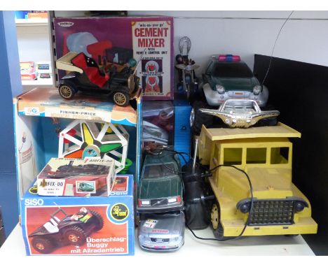 A collection of large scale remote controlled and similar vehicles including a cement mixer etc, some in original boxes