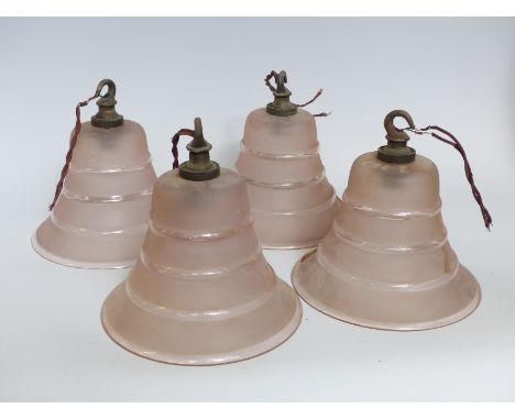 A set of four early 20thC pressed glass lamp shades, 12.5cm tall