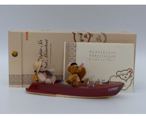 Steiff Teddy Bears Teddy Bear Set with Motor Boat, one with sailing cap and the other a straw hat in a lacquered limewood boa