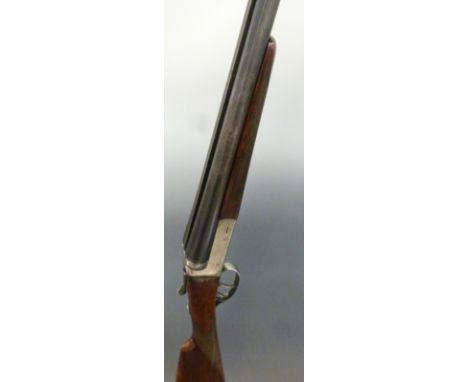 Master 12 bore side by side shotgun with chequered grip and forend, raised ball sight, double trigger and named 28" barrels, 