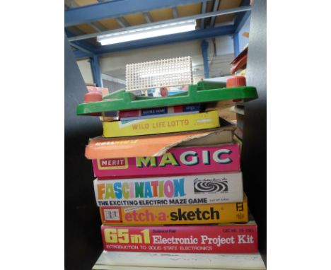 Eight various vintage games including etch-a-sketch, Merit Magic, 65 in 1 Electronic Project Kit, table top football etc 
