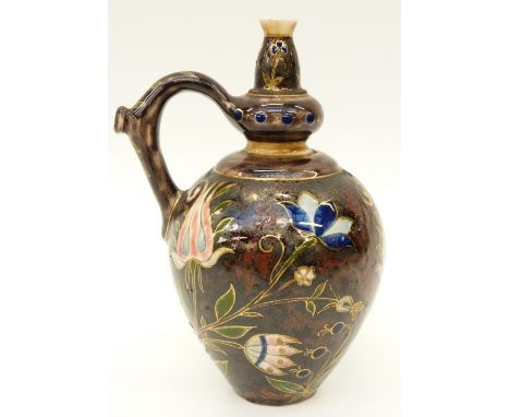 A continental ceramic vase with enamel floral decoration probably Zolnay Pecs