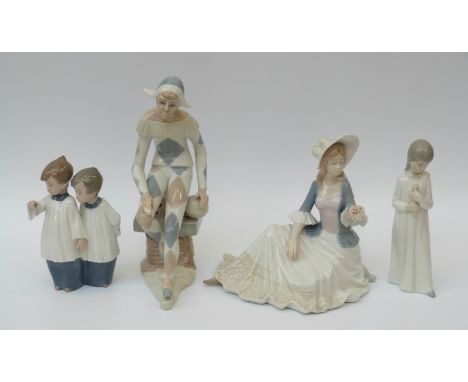 Four Spanish porcelain figures comprising clown, child in nightdress, lady with rose and Nao choirboys